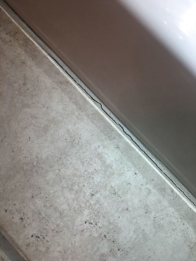 q how to economically fix grout cracks in bathroom