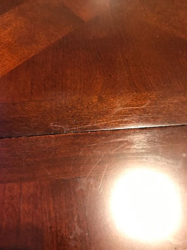 q how to remove scratches from dining room table