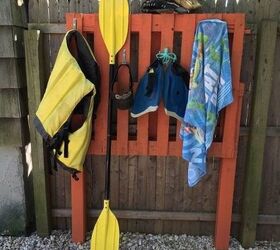 25 best diy pallet projects that will transform your home and yard, Outdoor Organization Rack From A Pallet Rob Courtney M