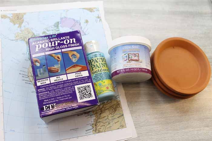 terracotta coasters with maps
