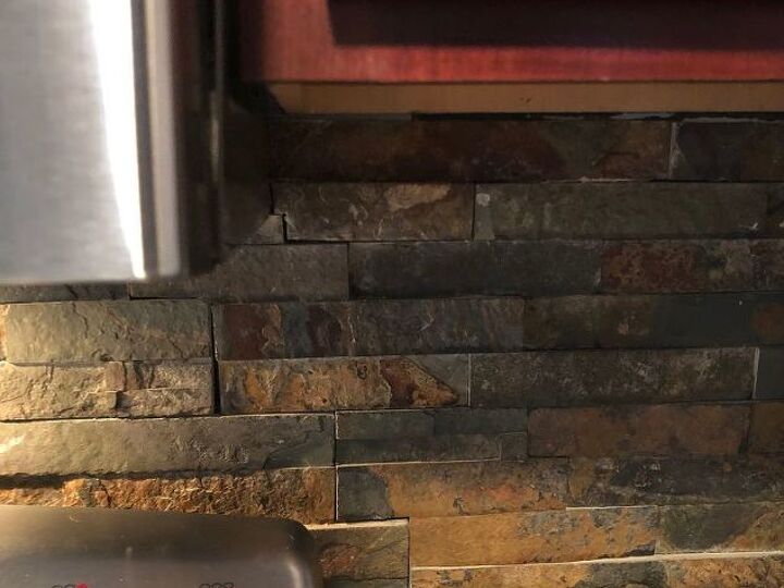 q how to lighten a dark faux rock backsplash