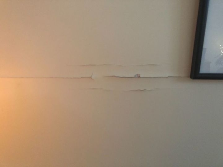 how do i repair a drywall tape crack on my living room wall