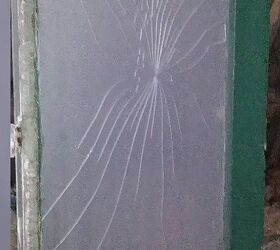 q an old window frame with a crack