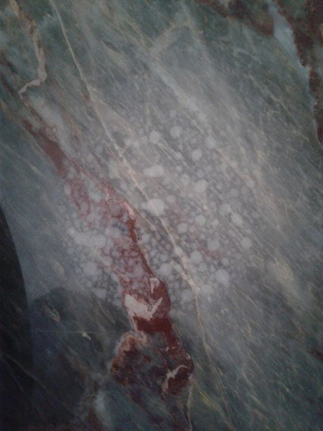q how to remove old water stains from tavertine marble coffee table