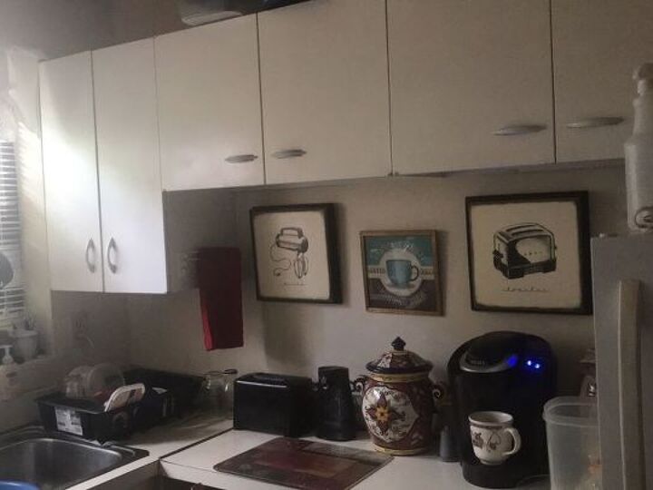 q i m stuck in an ugly 50s galley kitchen with metal cabinets in a ren