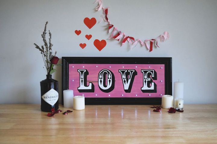 hand painted love sign with fairy lights perfect for valentine s day