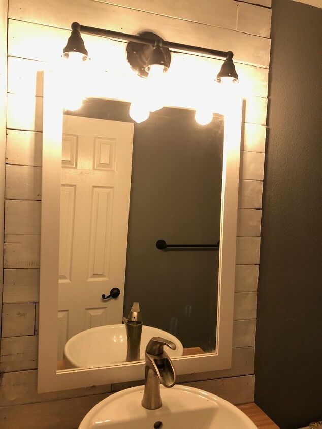 updating your old bathroom light fixture to industrial light fixture