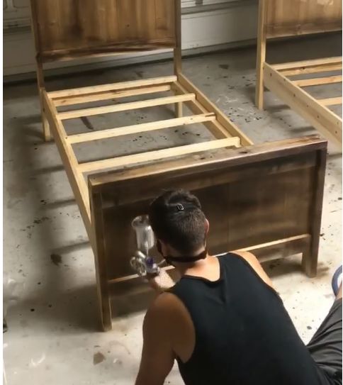 how to build a king bed with a stylish diy chevron headboard, Spray staining the bed