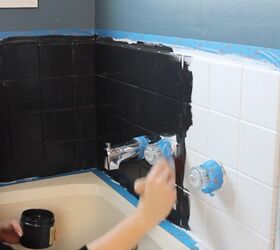 A woman paints her bathroom tile black for an incredibly beautiful update