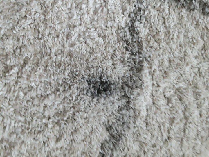 how can i get black grease out of a carpet