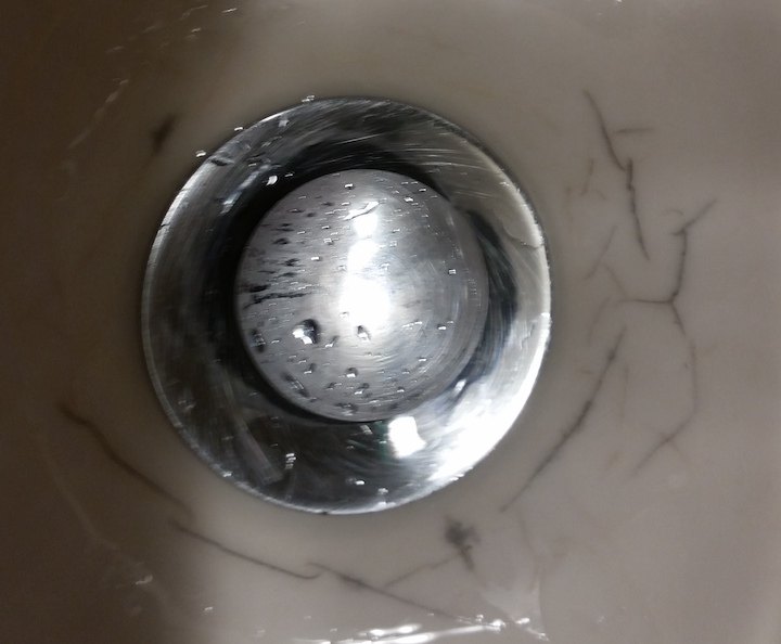 how to fix black veining around drain hole of vanity sink
