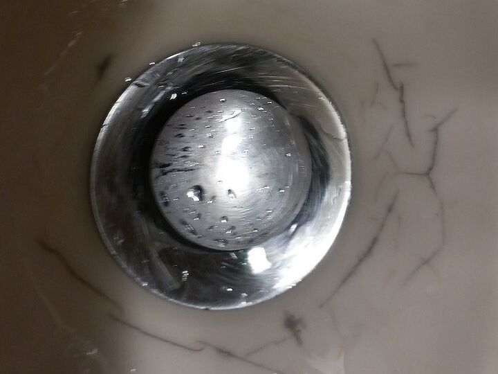 q how to fix black veining around drain hole of vanity sink