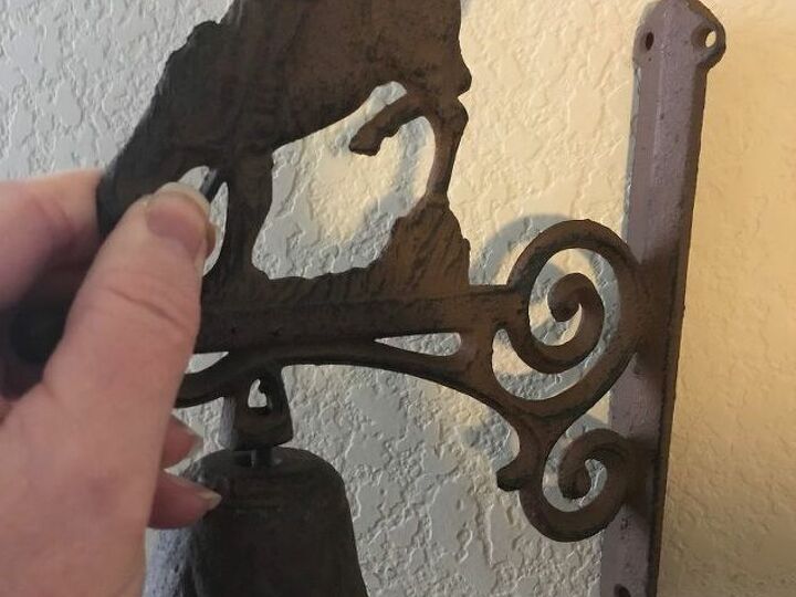 q hanging a cowboy bell