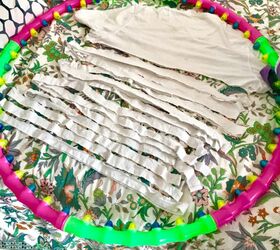 how to make a beautiful rag rug by making a loom from a hula hoop, T shirt strips and DIY hula hoop loom