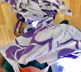 how to make a beautiful rag rug by making a loom from a hula hoop, Cut in one continuous strip