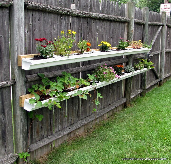 14 creative ways to plant a vertical garden maximize space, Repurpose Old Guttering for Herbs and Planters