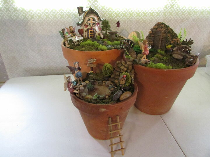 14 cute fairy garden ideas that will bring some magic to your garden, Three Tier Fairy Garden