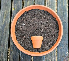 Bury a tiny pot inside a larger pot for this front porch idea