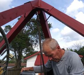refurbished recycled trampoline swing, My loving hubby hanging the swing