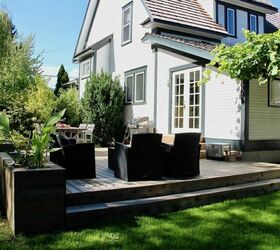 diy raised garden bed ideas to transform your garden space, Decking With Built In Raised Bed Planters