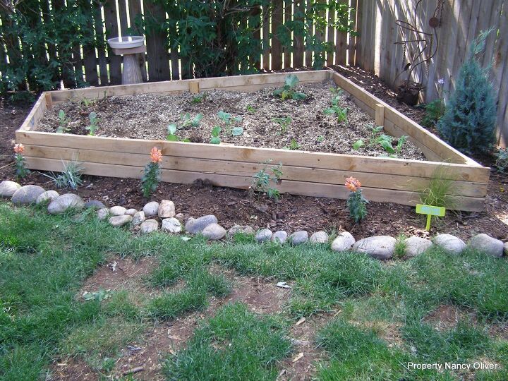 diy raised garden bed ideas to transform your garden space, The Answer To Odd Shaped Space In Your Garden