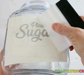 kitchen canister labels to help organize your kitchen, Squeegee the label onto the canister