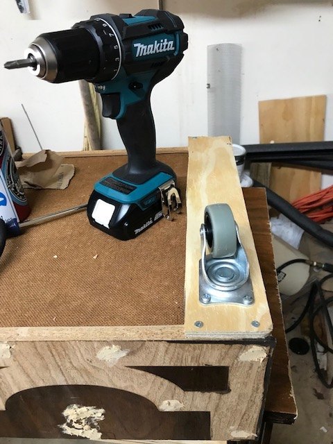 repurpose dresser to specialty kitchen cabinet, Adding wheels to the drawer