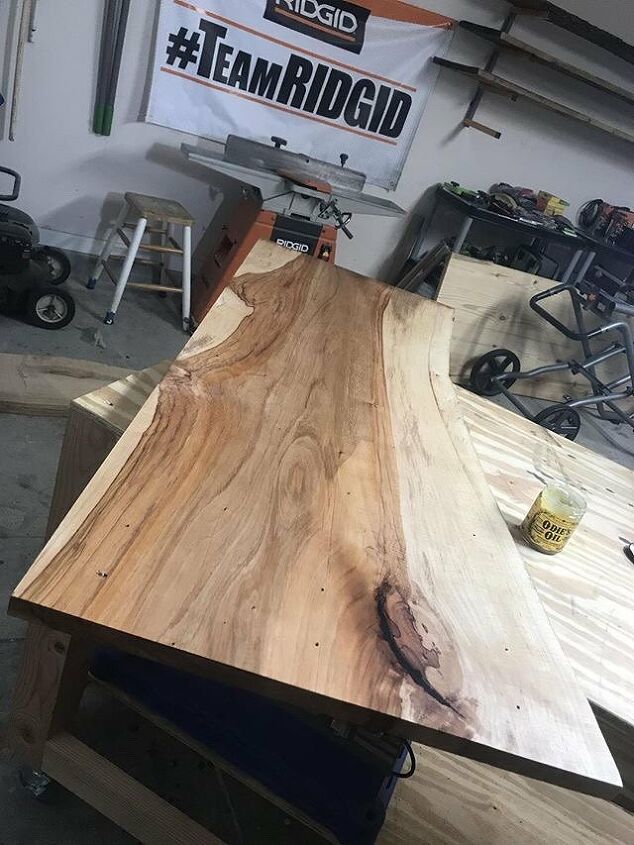how to make a beautiful diy live edge desk with a drawer, Sealing the desktop with oil