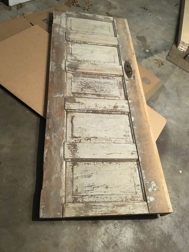 a reclaimed door becomes a farmhouse headboard