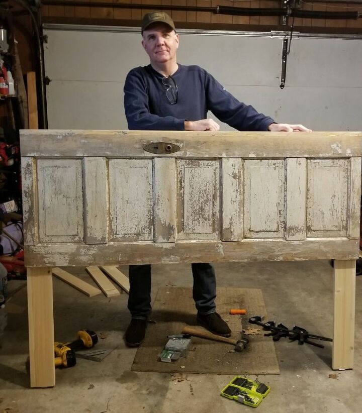 a reclaimed door becomes a farmhouse headboard