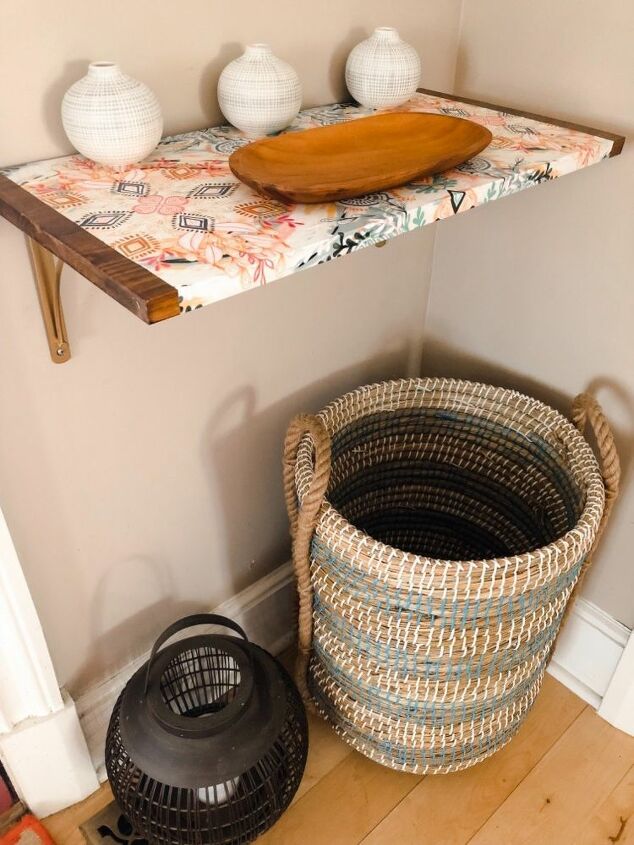 how i dressed up my wood wall shelf with mod podge and gift wrap