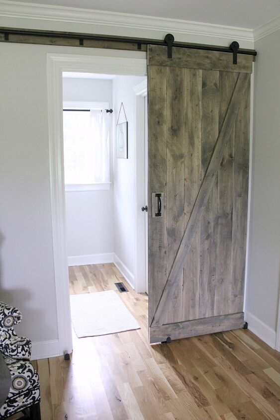 20 diy ideas to help you build your perfect barn door, A Sliding Barn Door for a Farmhouse Style Bedroom