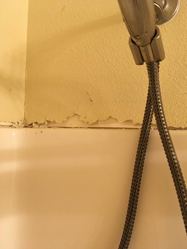 how do i repair the wall above a shower enclosure