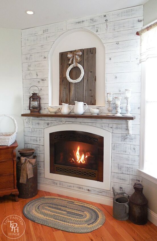 17 facelift ideas for a fireplace remodel in your home, Fitting Fresh Wood Planks Reinvigorated This Bedroom Fireplace