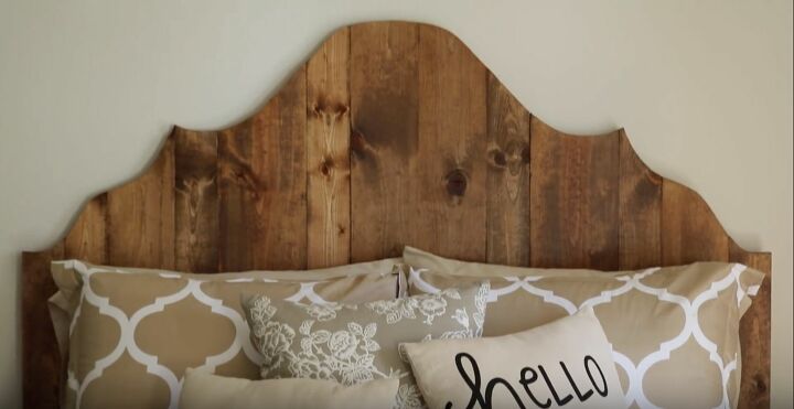 21 diy headboard ideas designed to spruce up your bedroom, This Rustic Queen Headboard Was Designed Using a Stencil