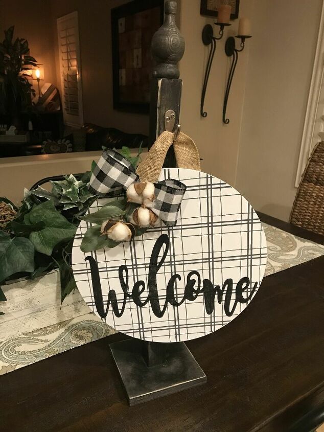 diy decor using dollar store items that you can make this weekend, Wooden charger makes a unique welcome sign