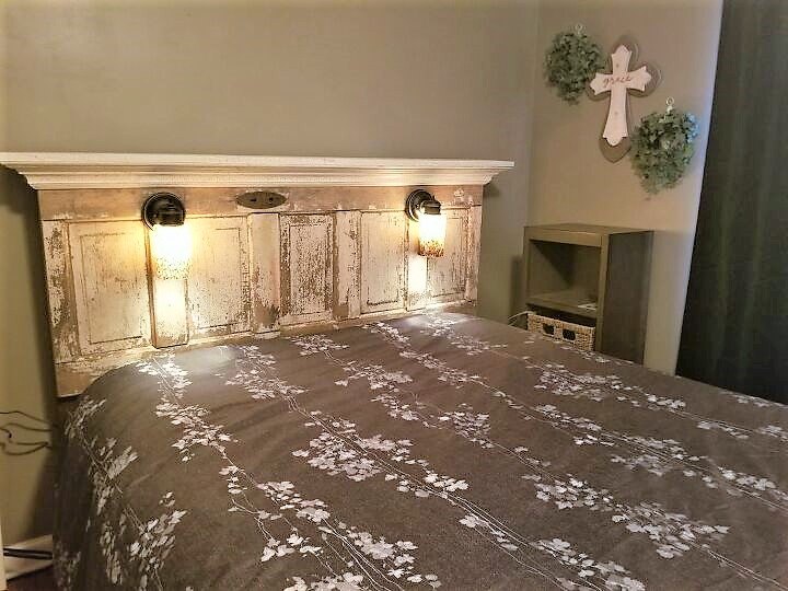 a reclaimed door becomes a farmhouse headboard