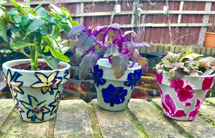 s terra cotta pots have never looked so glam not just for plants, Decoupage some fabric florals