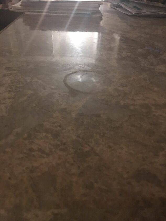 q scratched and burned marble table