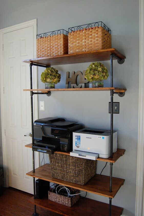 14 fantastic ways to make pipe shelves work for your home decor, Magically Modern Pipe Shelves