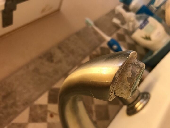 q how to remove mineral buildup on edge of water faucet spigots