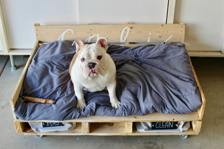 12 striking pallet bed projects for the perfect nights sleep, A Pallet Dog Bed with Wheels