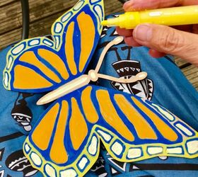 create a big beautiful butterfly for your garden fence with paint pens, Adding colour and detail to butterfly templa