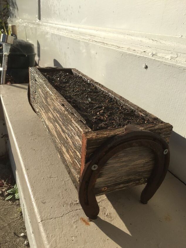 how can i attach horseshoes to a wood planter w o nailheads showing