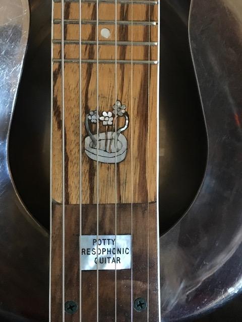 repurposing ivory piano key covers banjo inlays, Inlay on the neck of the resonator