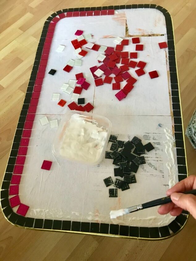 how to make a coffee table glamorous using glass mosaic tiles, Laying mosaic tiles down from thoutside edge