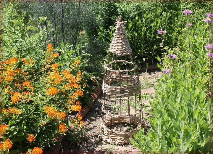 wicker style garden obelisk from a tomato cage