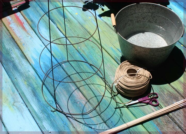 wicker style garden obelisk from a tomato cage