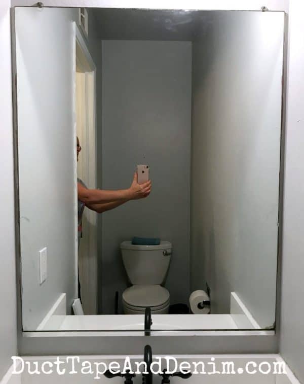 an easy way to frame a bathroom mirror