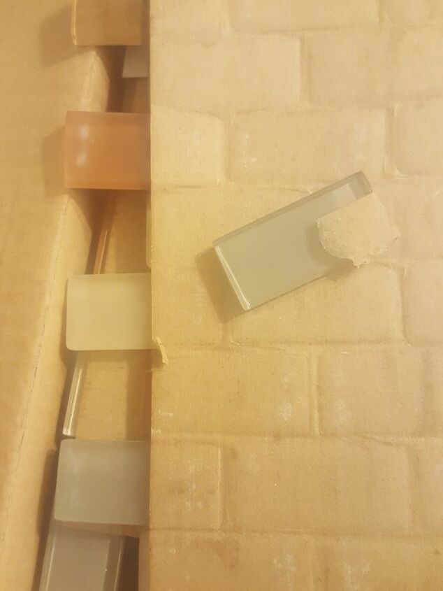 how do i get glued paper off glass tile
